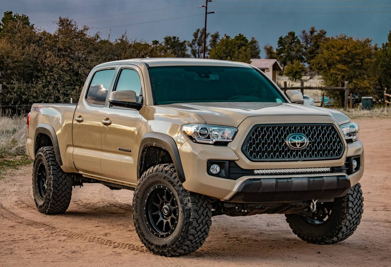 Lifted trail truck with off-road tires and a light bar