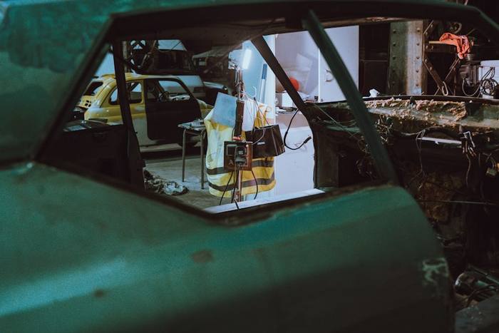 Stripped car shell in a workshop during body work