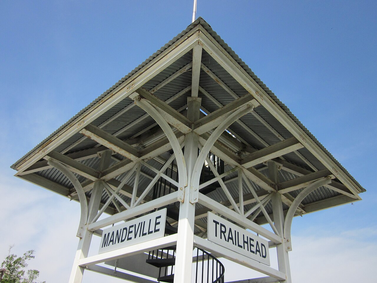 The Mandeville Trailhead tower and its sign on the Tammany Trace