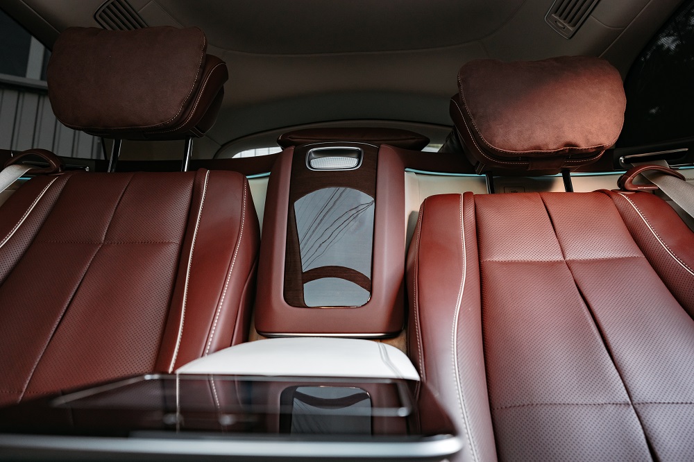 Brown leather rear seats in a luxury car
