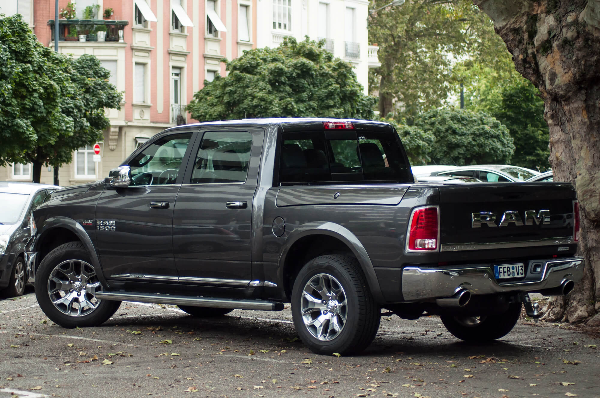 Grey RAM pickup truck parked on a city street